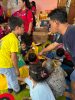 Penyerahan bantuan sembako oleh siswa Sekolah Citra Kasih Samarinda